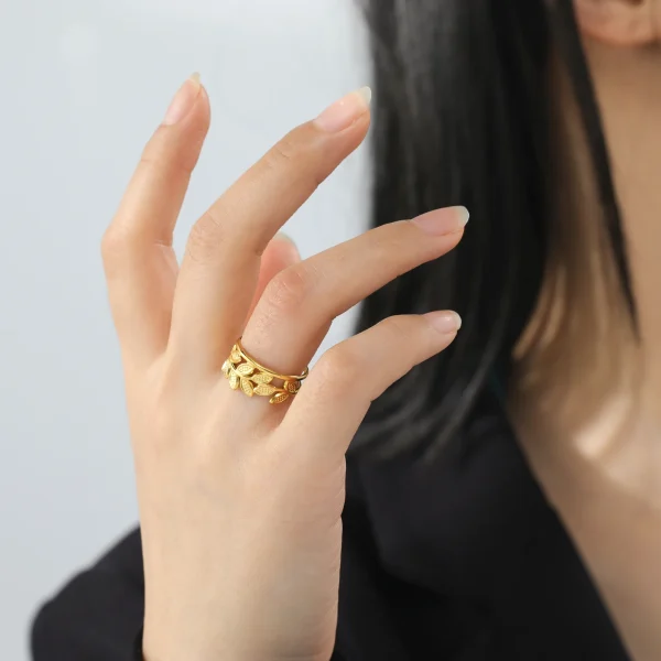 bague ouverte en forme de branche d'olivier en acier… – Chant… – Image 17
